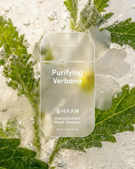 HAAN Purifying Verbena hand cleanser packaging with green leaves and water droplets in the background
